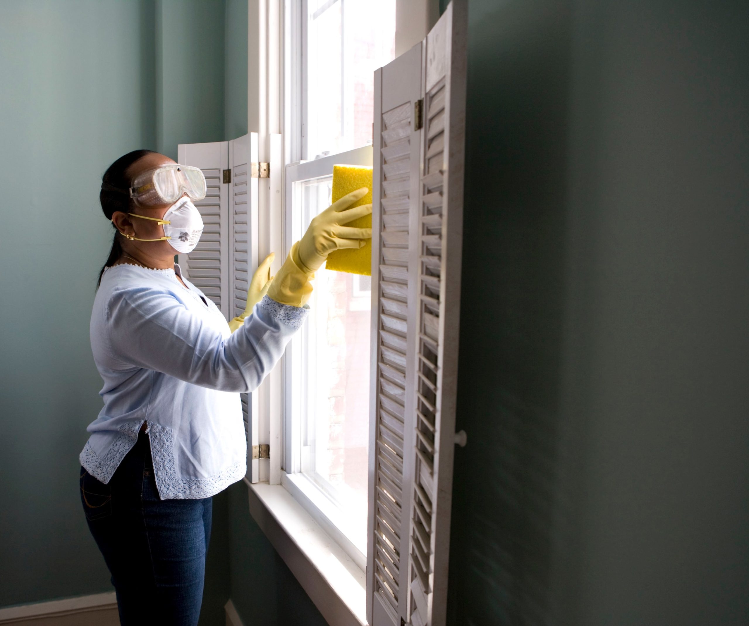 Cleaning pro woman at the window